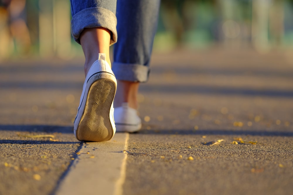 Person Walking On A Line Drawn On The Ground