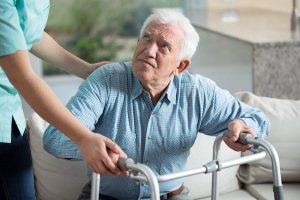 Elderly Man Looking Angrily At His Caretaker