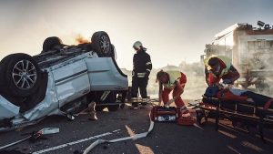 Firefighters Working On A Car Crash Scene