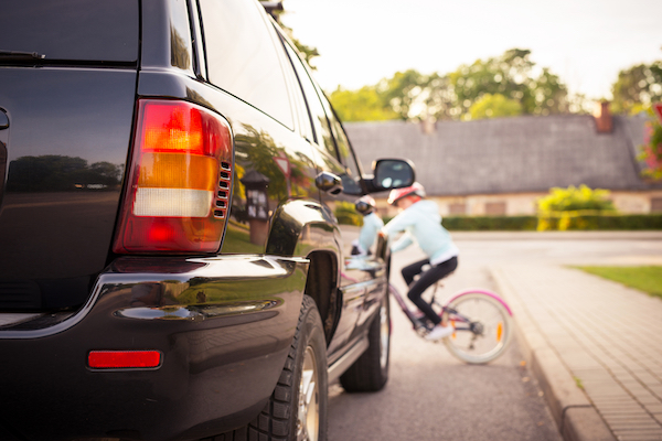 Child On A Bike About To Be Hit By A Car