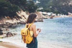 Tourist With A Yellow Backpack