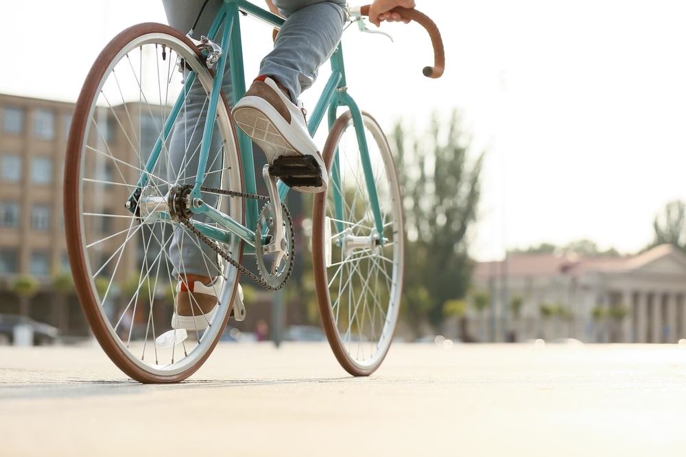 Man Riding A Light Blue Bicycle