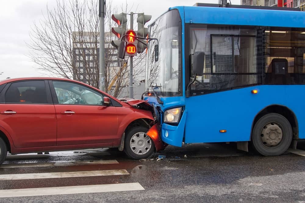 Blue Bus Frontally Crashed Into A Red Car