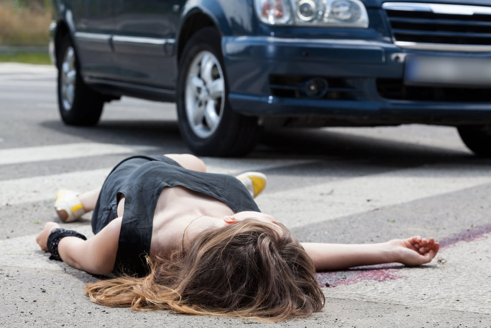 Woman Laying Unconscious On The Road