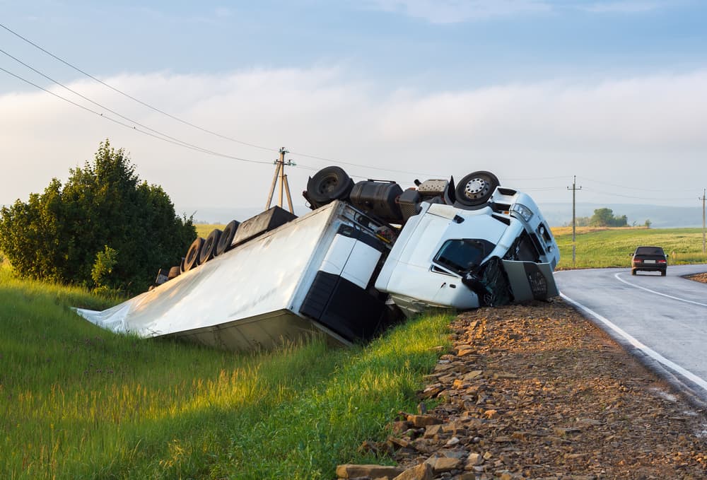 White Truck Rolled On Its Roof In The Ditch