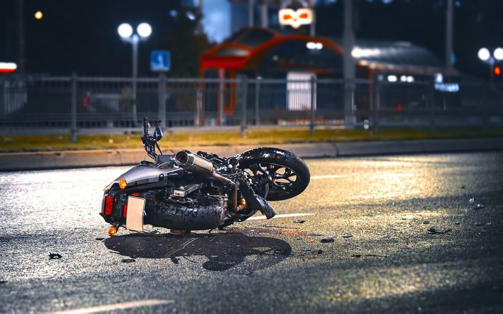 Motorcycle Laying Damaged On The Road